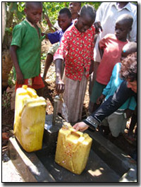 Running water - Ugandians filling water jugs.